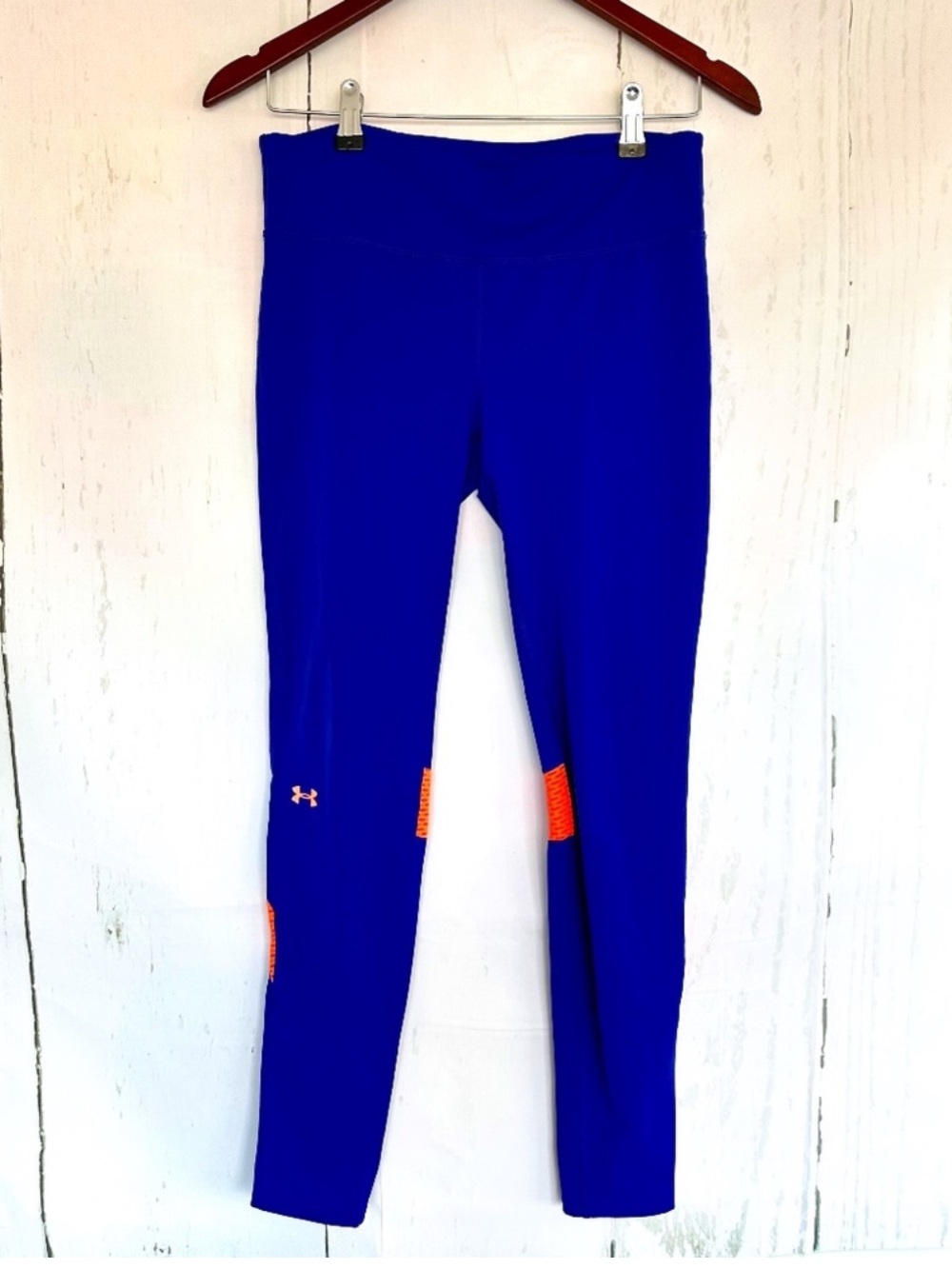 Under Armour purple and orange mesh workout leggings